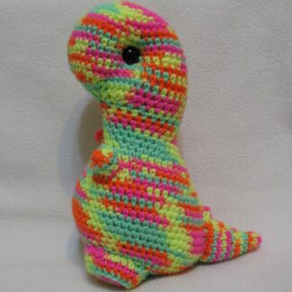 T-rex plush amigurumi - neon pink, orange, yellow, and green