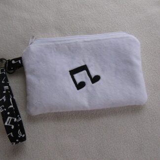 Fuzzy music note zippered wristlet